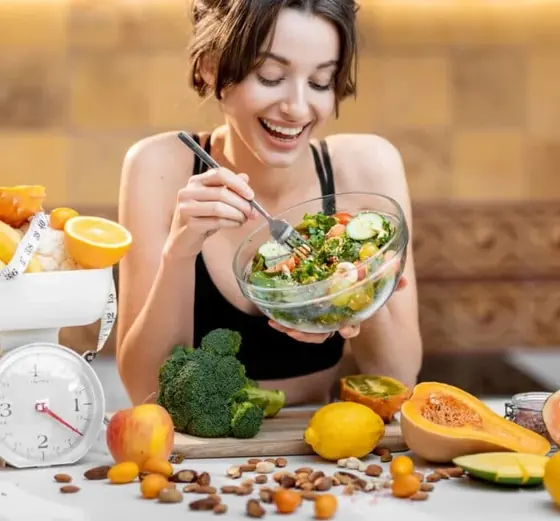 Balanced plate of whole foods representing the calorie deficit that drives realistic weight loss